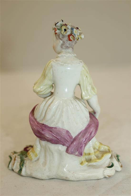 A Derby Pale Family figure of a seated lady, c.1756-9, height 11cm, tiny losses